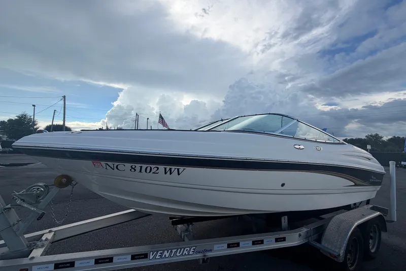 The Image of 2003 Chaparral 183 SS boat on trailer under cloudy sky. - 0