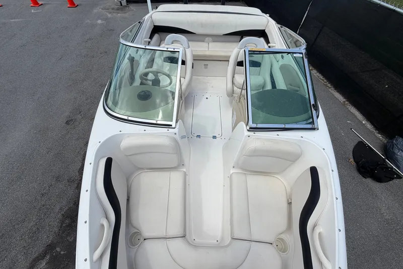 Slide: The Image of 2003 Chaparral 183 SS boat interior with white seating and dual windshields. - 41