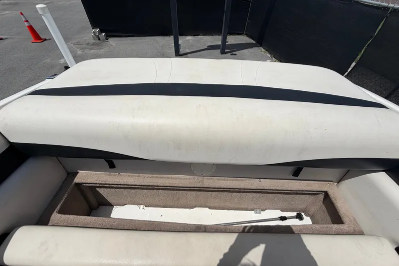 Slide: The Image of 2003 Chaparral 183 SS boat interior storage compartment with cushioned seating. - 51