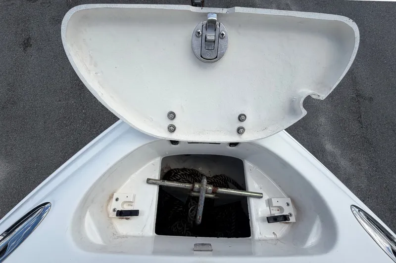 Slide: The Image of Anchor locker of a 2003 Chaparral 183 SS boat with an open lid. - 39