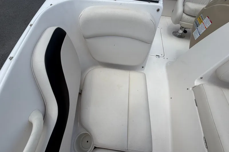 Slide: The Image of White seating area in a 2003 Chaparral 183 SS boat interior. - 44