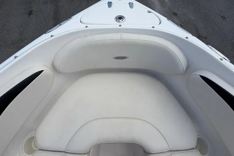 Slide: The Image of The bow of a 2003 Chaparral 183 SS with white upholstery. - 37