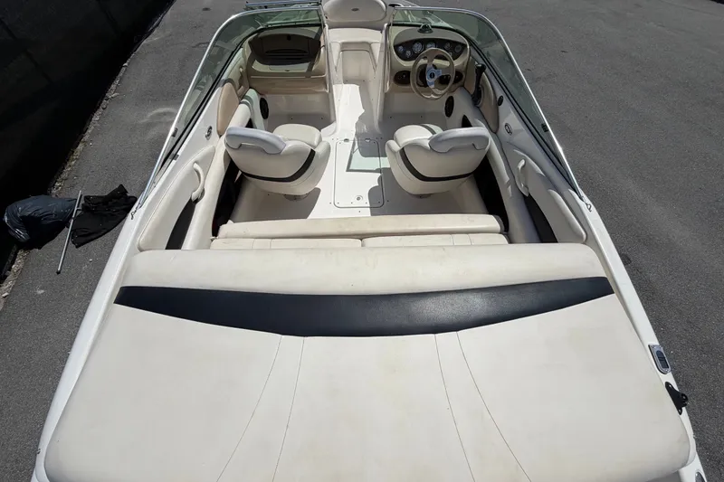 Slide: The Image of 2003 Chaparral 183 SS boat interior with white seating and steering console. - 11
