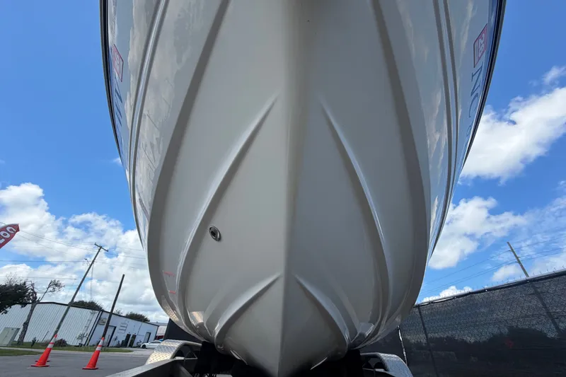 Slide: The Image of 2003 Chaparral 183 SS boat hull against blue sky with clouds. - 10