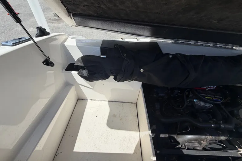 Slide: The Image of Open engine compartment of a 2003 Chaparral 183 SS boat, showing interior details. - 54