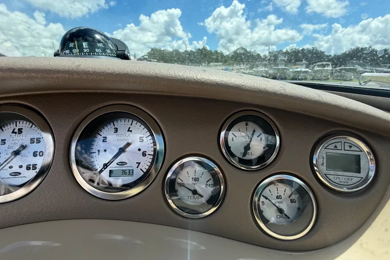 Slide: The Image of Dashboard of a 2003 Chaparral 183 SS boat with gauges and compass. - 23