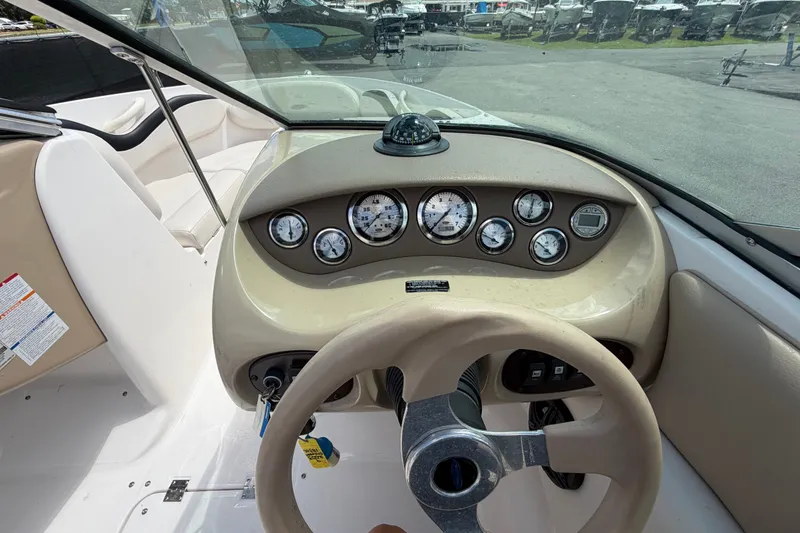Slide: The Image of 2003 Chaparral 183 SS boat dashboard with gauges and steering wheel. - 21
