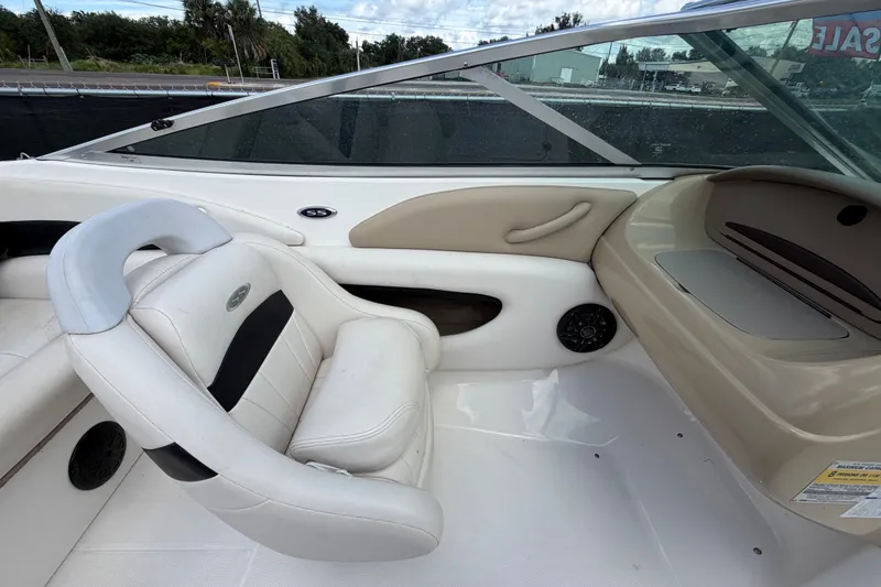 Slide: The Image of Interior of a 2003 Chaparral 183 SS boat with white seating and dashboard. - 29