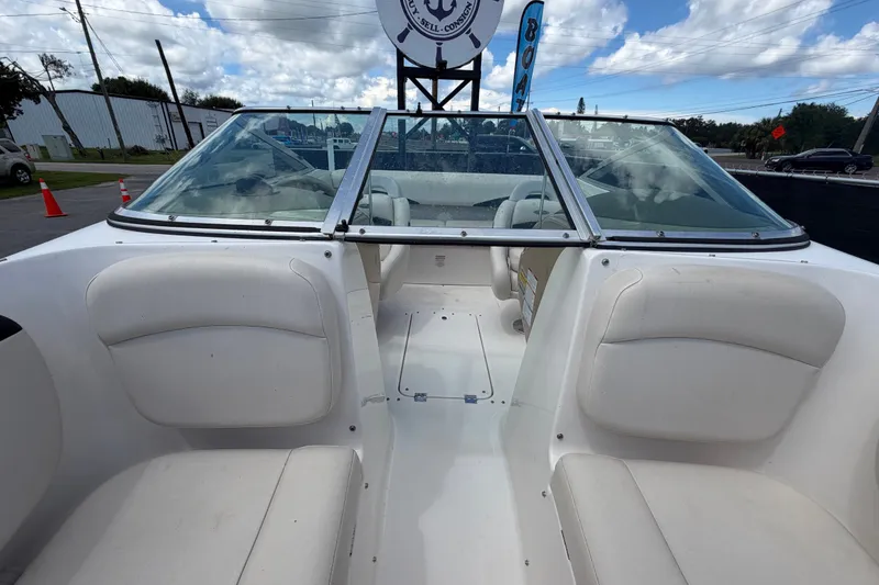 Slide: The Image of 2003 Chaparral 183 SS boat interior with white seating and windshield. - 46