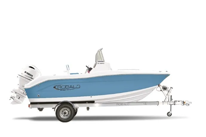 The Image of 2027 Robalo R180 Center Console boat on trailer, side view, blue and white design. - 1