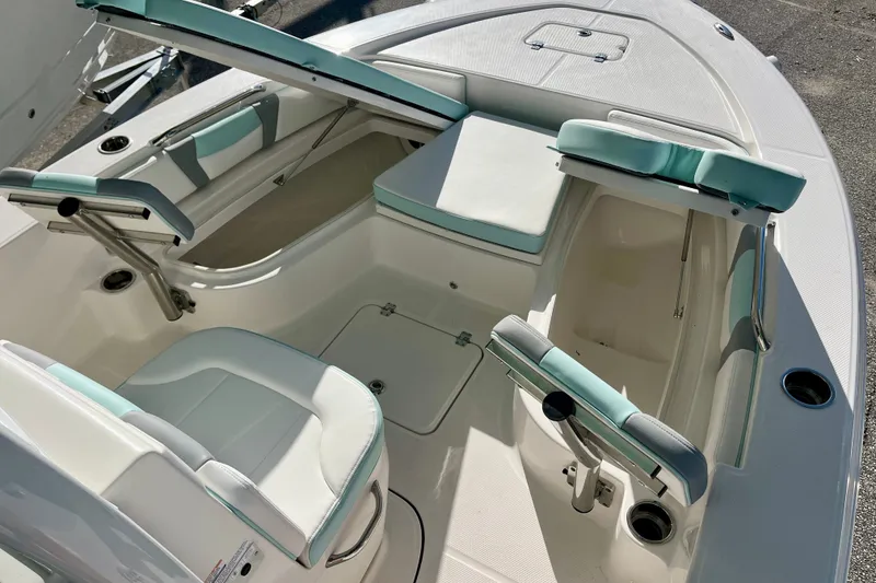 Slide: The Image of 2027 Robalo 226 Cayman boat interior with seating and storage compartments. - 21