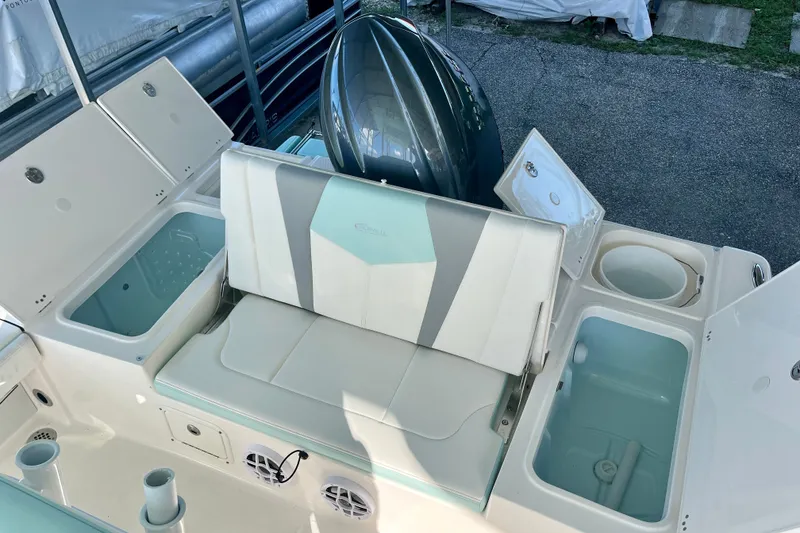 Slide: The Image of 2027 Robalo 226 Cayman boat interior with seating and storage compartments. - 10