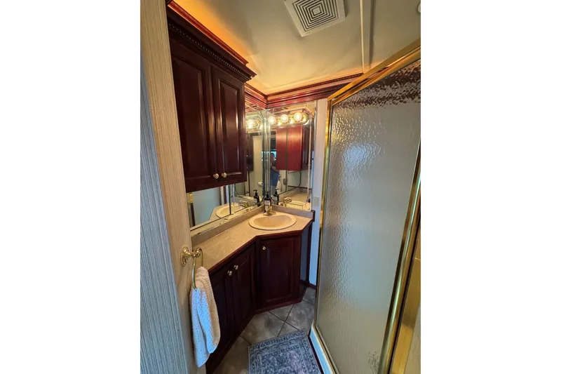 Slide: The Image of Luxurious bathroom in 2005 Sumerset houseboat with wood cabinetry and glass shower. - 70