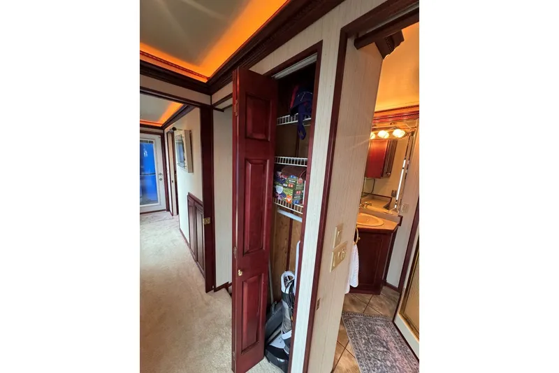 Slide: The Image of Interior of 2005 Sumerset houseboat with hallway, closet, and bathroom view. - 72