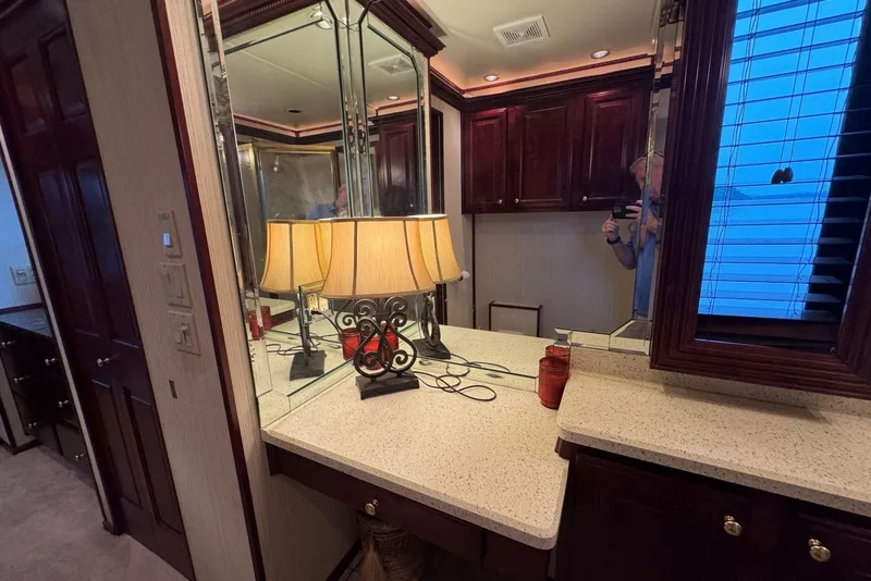 Slide: The Image of Luxurious Sumerset 2005 houseboat interior with mirrored vanity and elegant lamp. - 88