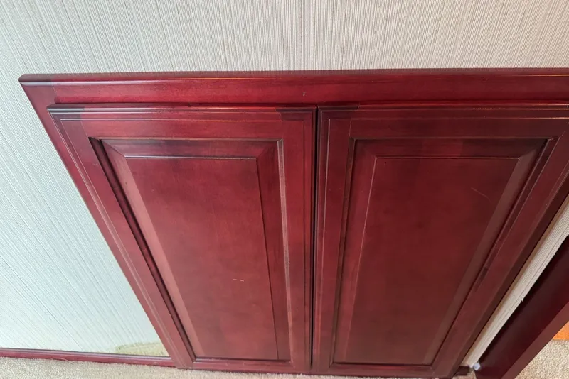Slide: The Image of Wooden cabinet doors on a Sumerset 16'6" X 63, 2005 model. - 76