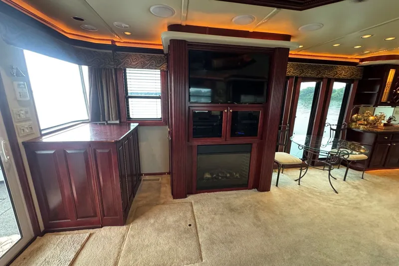 Slide: The Image of Luxurious 2005 Sumerset houseboat interior with elegant wood cabinetry and large windows. - 46