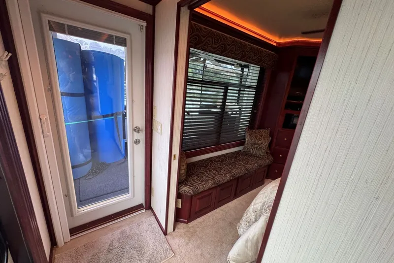 Slide: The Image of Interior of a 2005 Sumerset houseboat with cozy seating and elegant decor. - 78