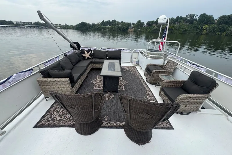 Slide: The Image of Luxurious 2005 Sumerset houseboat deck with wicker furniture and scenic lake view. - 33