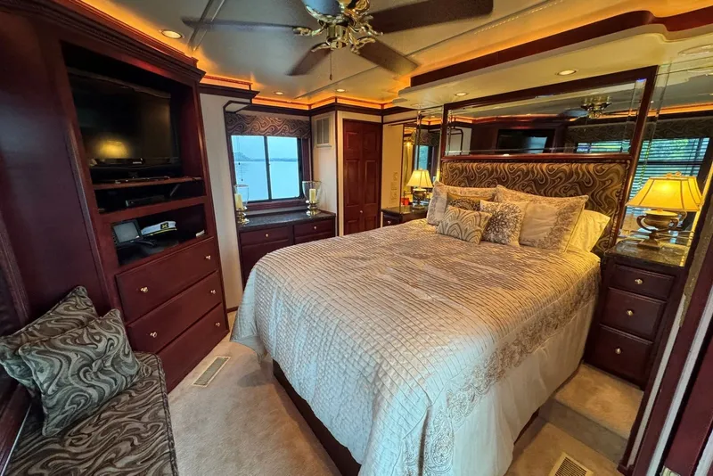 Slide: The Image of Luxurious bedroom interior of a 2005 Sumerset 16'6" X 63 houseboat with elegant decor. - 79