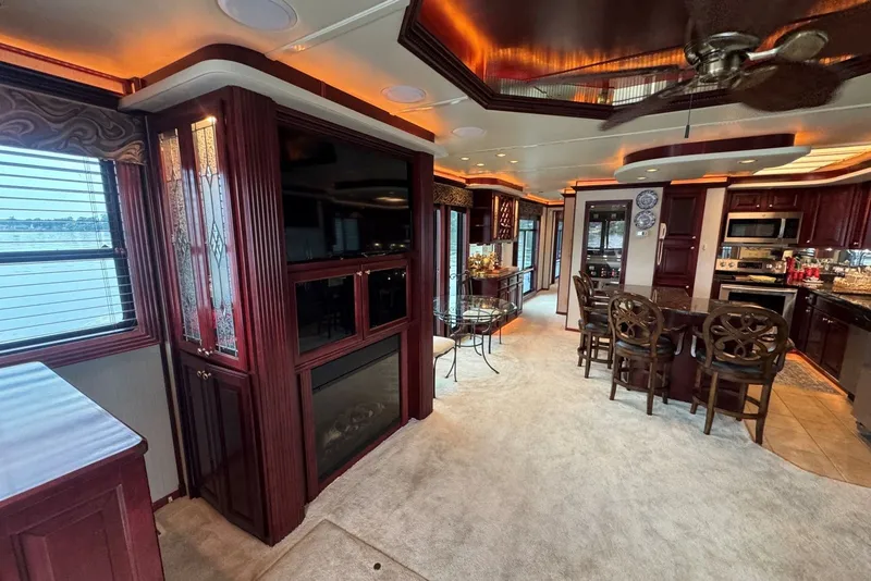 Slide: The Image of Luxurious 2005 Sumerset houseboat interior with elegant wood finishes and modern kitchen. - 44