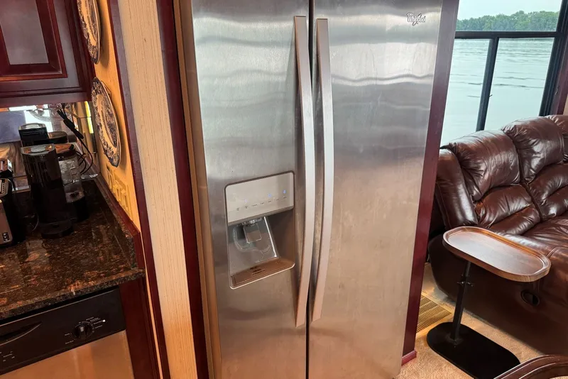 Slide: The Image of Stainless steel refrigerator in a 2005 Sumerset houseboat kitchen with lake view. - 61