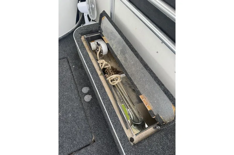 Slide: The Image of Storage compartment on 2005 Sumerset 16'6" X 63 houseboat, containing rope and chain. - 110