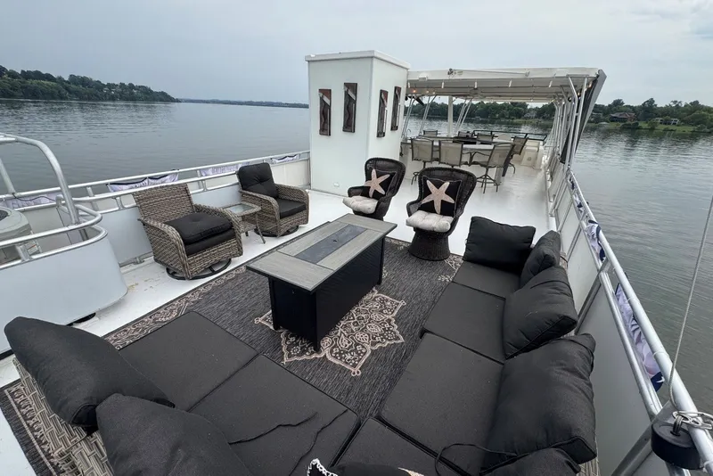 Slide: The Image of Luxurious 2005 Sumerset houseboat deck with elegant seating and scenic water views. - 35