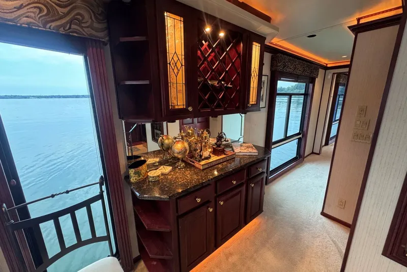 Slide: The Image of Luxurious 2005 Sumerset houseboat interior with elegant cabinetry and scenic water views. - 62