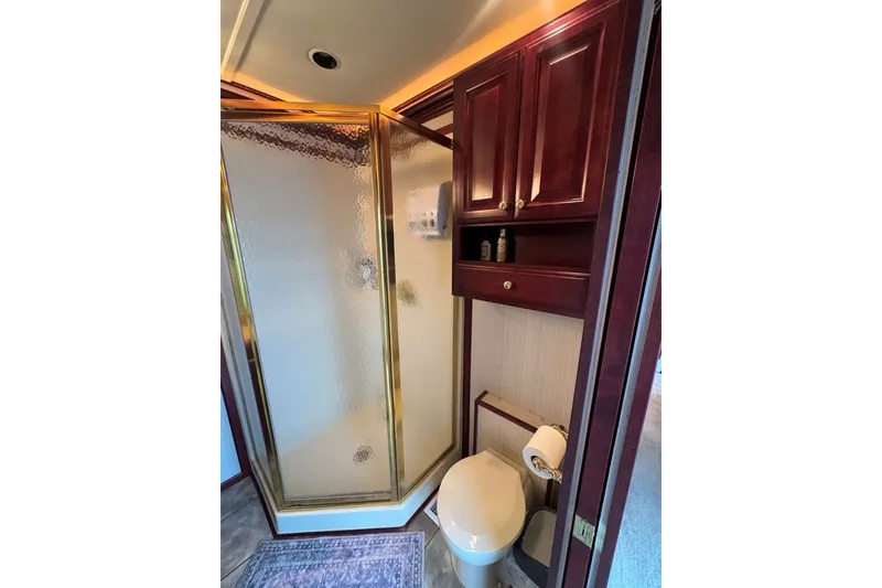 Slide: The Image of Luxurious bathroom in 2005 Sumerset houseboat with shower, wooden cabinets, and toilet. - 68