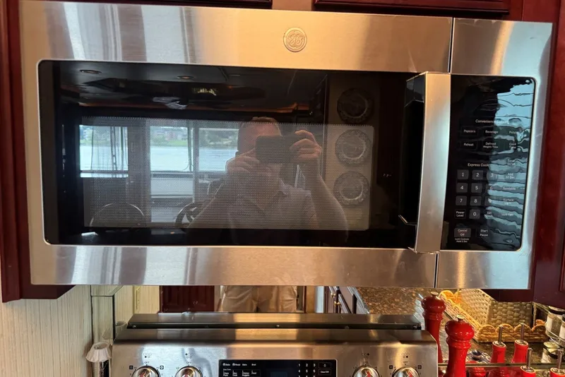Slide: The Image of Stainless steel GE microwave in a 2005 Sumerset houseboat kitchen. - 59