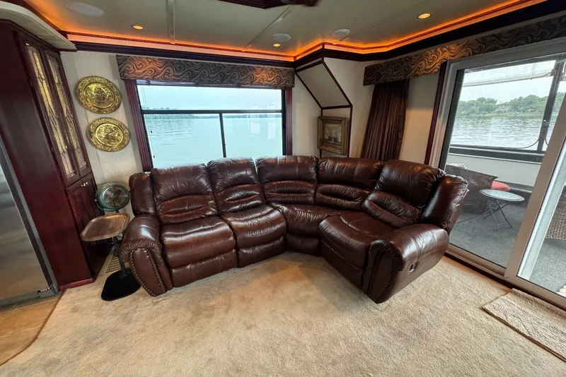 Slide: The Image of Luxurious Sumerset 2005 houseboat interior with leather sectional and lake view. - 45