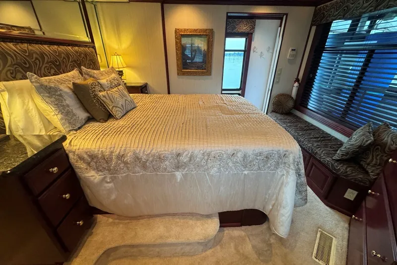 Slide: The Image of Luxurious bedroom interior of a 2005 Sumerset 16'6" X 63 houseboat with elegant decor. - 90
