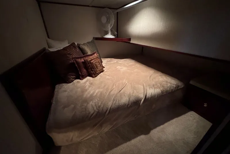 Slide: The Image of Cozy bedroom interior in a 2005 Sumerset 16'6" X 63 houseboat with plush bedding. - 74