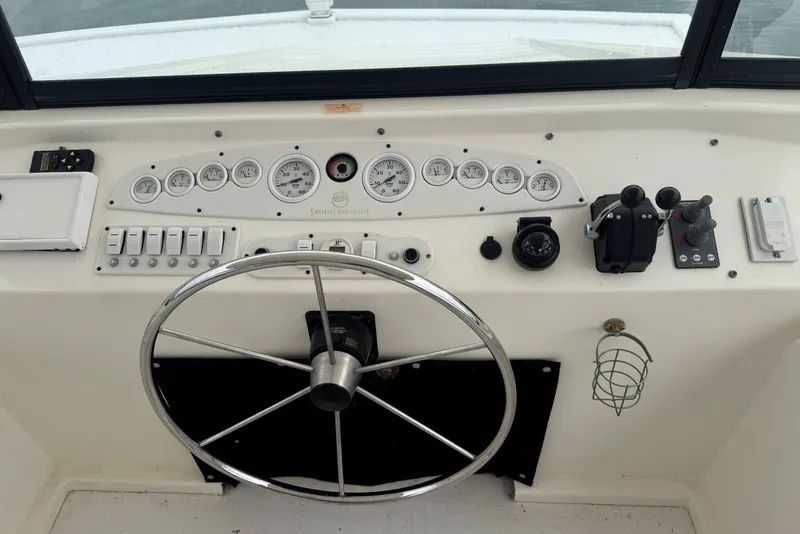 Slide: The Image of Helm of 2005 Sumerset 16'6" X 63 houseboat with steering wheel and control panel. - 25