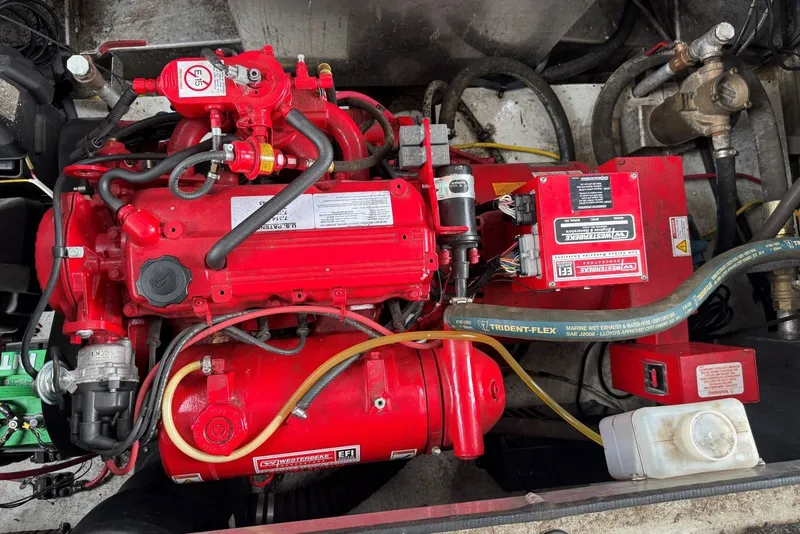 Slide: The Image of Red engine compartment of a 2005 Sumerset 16'6" X 63 houseboat. - 100