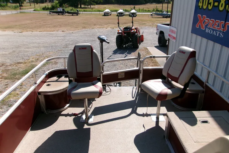 Slide: The Image of 2017 Lowe Ultra 162 Fish & Cruise boat interior with seating and fishing setup. - 12
