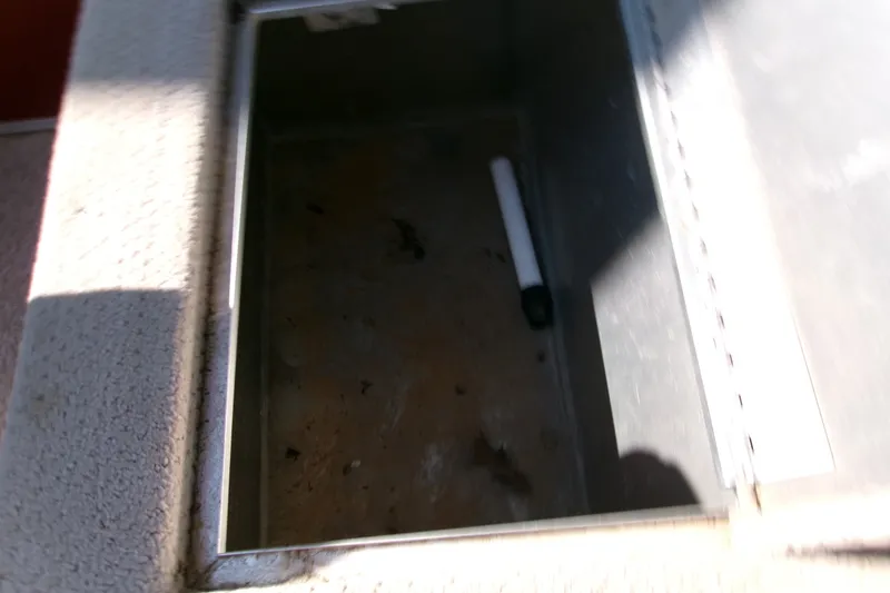 Slide: The Image of Open storage compartment in 2017 Lowe Ultra 162 Fish & Cruise boat. - 19