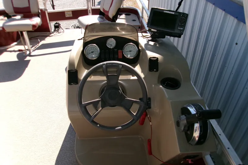 Slide: The Image of 2017 Lowe Ultra 162 Fish & Cruise boat console with steering wheel and gauges. - 7