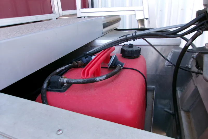 Slide: The Image of Red fuel tank in a 2017 Lowe Ultra 162 Fish & Cruise boat. - 3