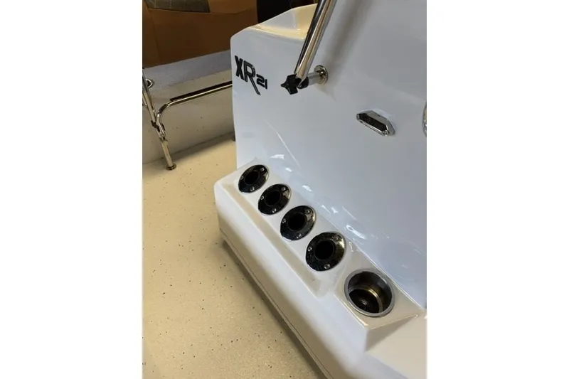Slide: The Image of 2027 Xpress XR21 Bay boat interior with rod holders and sleek design. - 14