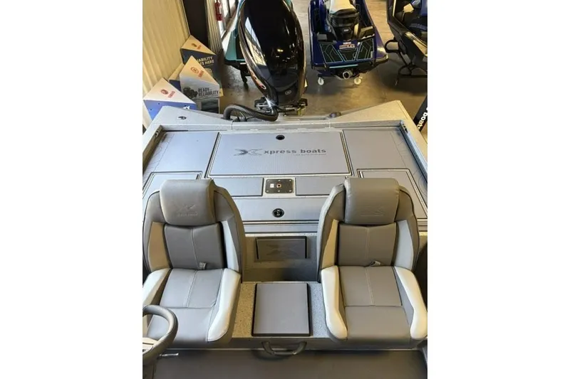 Slide: The Image of 2027 Xpress H20 Crappie boat interior with dual seats and storage compartments. - 17