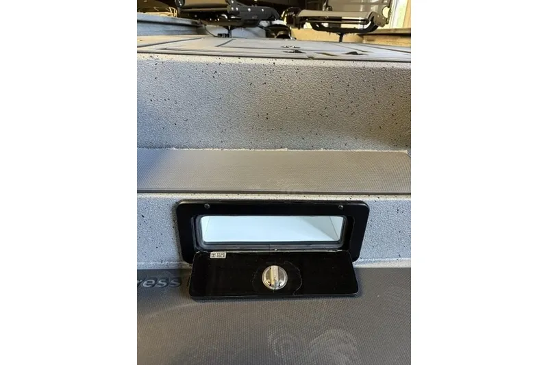 Slide: The Image of 2027 Xpress H20 Crappie boat interior detail with storage compartment. - 11