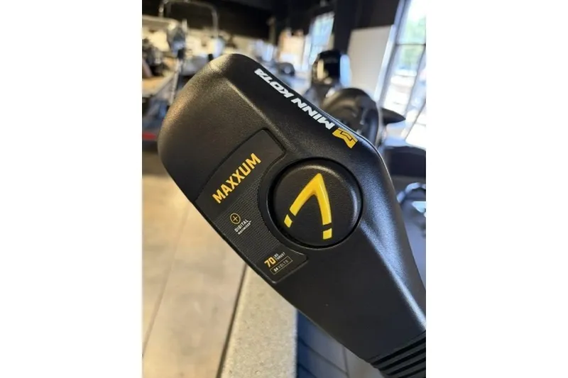 Slide: The Image of Minn Kota Maxxum trolling motor handle, featuring directional control and speed settings. - 5