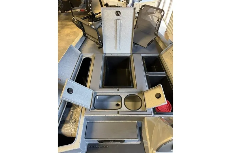 Slide: The Image of 2027 Xpress H20 Crappie boat interior with open storage compartments and seating. - 8