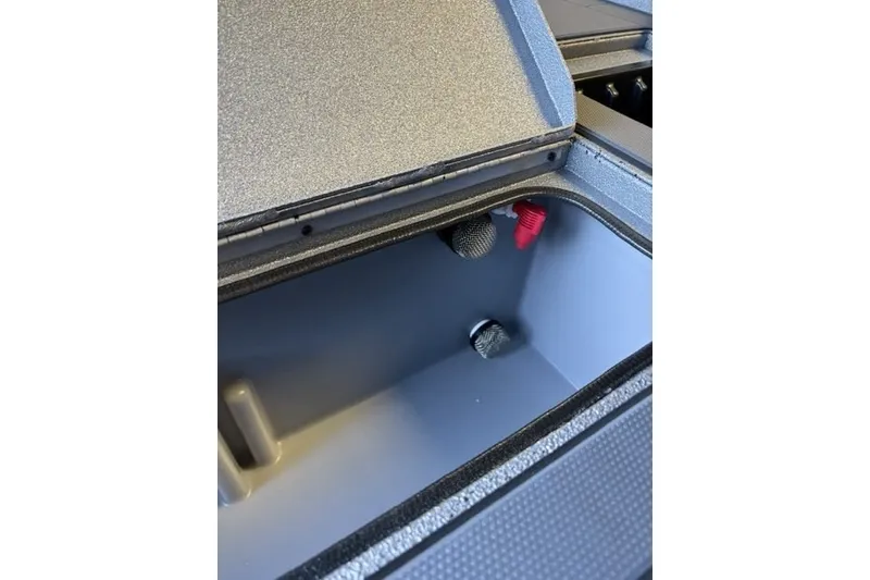 Slide: The Image of Open storage compartment of 2027 Xpress H20 Crappie boat, showcasing interior details. - 19