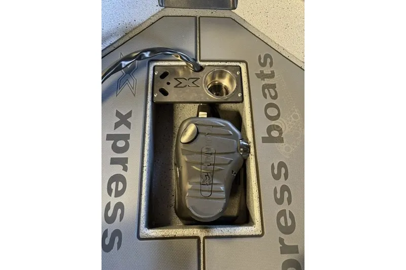 Slide: The Image of Xpress H20 Crappie 2027 boat deck with pedal and cup holder. - 6