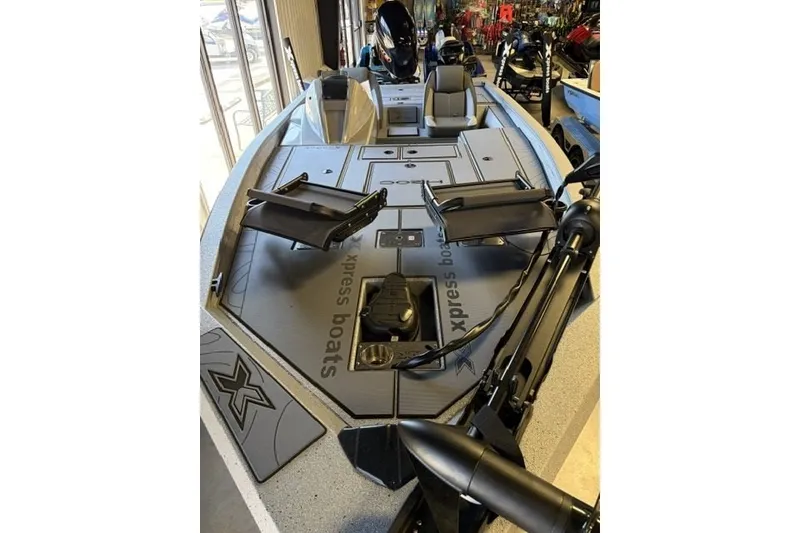 Slide: The Image of 2027 Xpress H20 Crappie boat interior with seating and fishing equipment. - 3