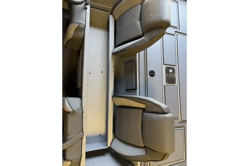 Slide: The Image of 2027 Xpress H20 Crappie boat interior with gray seating and storage compartments. - 18