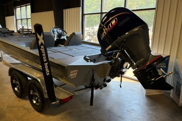 Slide: The Image of 2027 Xpress H20 Crappie boat with Yamaha outboard motor in showroom. - 2